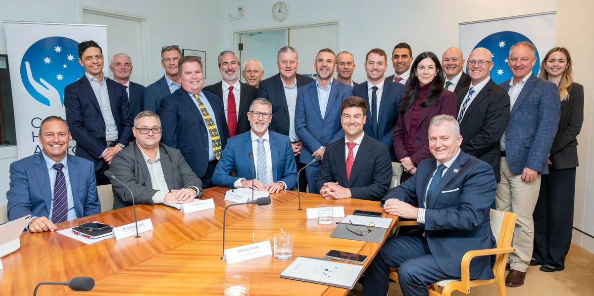 Catholic Health Australia aged care providers seated around a boardroom table in Canberra