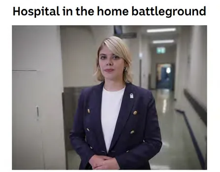 Dr Katharine Bassett on camera in a hospital corridor for a Hospital in the Home news segment